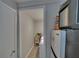 Functional laundry room with tile floors and access to extra storage space, adjacent to appliances at 750 Azalea Dr, Bartow, FL 33830