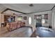 The living room boasts a large entertainment center, beams, and comfortable seating, perfect for relaxation at 750 Azalea Dr, Bartow, FL 33830