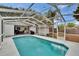 Beautiful screened-in pool area with lush landscaping at 750 Azalea Dr, Bartow, FL 33830