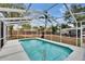 Inviting screened-in pool area for year-round enjoyment in the backyard at 750 Azalea Dr, Bartow, FL 33830