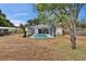 Large backyard featuring a relaxing screened pool area at 750 Azalea Dr, Bartow, FL 33830