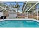 Relaxing screened-in pool for year-round enjoyment in the backyard at 750 Azalea Dr, Bartow, FL 33830