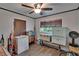 A multipurpose room with natural light from two windows and wood-look flooring at 750 Azalea Dr, Bartow, FL 33830