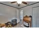 Spare room with a ceiling fan, light gray walls, and a small desk at 750 Azalea Dr, Bartow, FL 33830