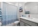 Bathroom featuring a shower/tub combo, stylish vanity and large mirror at 921 Fieldstone Way, Haines City, FL 33844