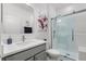 Bathroom features a glass shower, modern vanity, and stylish mirror, creating a bright and functional space at 921 Fieldstone Way, Haines City, FL 33844