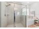 Bathroom featuring glass shower, soaking tub, and tile surround at 921 Fieldstone Way, Haines City, FL 33844