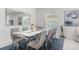 Formal dining area with elegant decor, ample seating, and a modern chandelier at 921 Fieldstone Way, Haines City, FL 33844