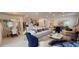 Open concept living room seamlessly connecting to the kitchen and dining area at 921 Fieldstone Way, Haines City, FL 33844