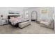 Spacious main bedroom with plush carpet, large windows, and a comfortable seating area at 921 Fieldstone Way, Haines City, FL 33844
