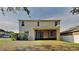 Two-story home featuring a screened-in porch and a well-maintained backyard at 3002 Sunscape Ter, Groveland, FL 34736