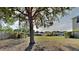 Large backyard featuring mature tree providing plenty of shade and surrounding greenery at 3002 Sunscape Ter, Groveland, FL 34736
