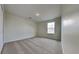 Cozy bedroom with neutral carpet and a large closet and window for ample natural light at 3002 Sunscape Ter, Groveland, FL 34736