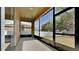 Screened lanai offering an outdoor living space with views of the backyard and surrounding landscape at 3002 Sunscape Ter, Groveland, FL 34736