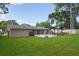 Expansive backyard with a patio, lush lawn, and gazebo, perfect for outdoor relaxation at 781 Little Pine Dr, South Daytona, FL 32119