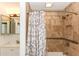 Updated bathroom with tiled shower, neutral walls, and decorative mirror at 781 Little Pine Dr, South Daytona, FL 32119