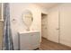 This bathroom has a gray sink and a large oval mirror at 781 Little Pine Dr, South Daytona, FL 32119
