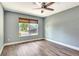 This is a nice bedroom with wood flooring and a window that lets in a lot of natural light at 781 Little Pine Dr, South Daytona, FL 32119