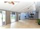 Bonus room with neutral paint, bright ceiling, and tile flooring that opens to the backyard at 781 Little Pine Dr, South Daytona, FL 32119