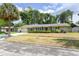 Charming single-story home with a well-manicured lawn and mature palm tree, creating a welcoming curb appeal at 781 Little Pine Dr, South Daytona, FL 32119