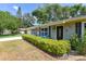 Charming home with a well-maintained front yard, showcasing a beautiful bush hedge and decorative exterior features at 781 Little Pine Dr, South Daytona, FL 32119