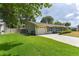 Charming one-story home featuring an attached garage and a well-manicured lawn at 781 Little Pine Dr, South Daytona, FL 32119