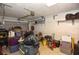 Spacious two-car garage with ample storage, shelving, and organized items for a functional workspace at 781 Little Pine Dr, South Daytona, FL 32119
