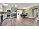 Modern kitchen with stainless steel appliances, sleek cabinets, and an adjacent dining area at 781 Little Pine Dr, South Daytona, FL 32119