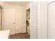 Convenient laundry closet with stacked washer/dryer unit tucked behind bi-fold doors at 781 Little Pine Dr, South Daytona, FL 32119