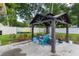 Stylish gazebo featuring comfortable seating and decorative string lights, perfect for relaxation at 781 Little Pine Dr, South Daytona, FL 32119