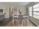 Neutral dining area with decor, open to living area and lots of light from the window at 1610 Reynolds Rd # 5, Lakeland, FL 33801