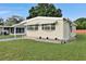 Charming home exterior featuring a manicured lawn, and classic design at 1610 Reynolds Rd # 5, Lakeland, FL 33801