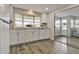 This kitchen offers a bay window, tile backsplash, neutral granite countertops and white appliances at 1610 Reynolds Rd # 5, Lakeland, FL 33801