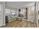 Bright living room with modern sectional sofa, sliding glass doors, and wood-look flooring at 1610 Reynolds Rd # 5, Lakeland, FL 33801