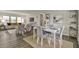 Open living and dining area with neutral decor, wood flooring and lots of light at 1610 Reynolds Rd # 5, Lakeland, FL 33801