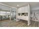 Relaxing living space with sliding doors and bar area to the dining room and kitchen at 1610 Reynolds Rd # 5, Lakeland, FL 33801