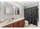 Bathroom with double vanity, shower and tub combination at 358 Canna Dr, Davenport, FL 33897