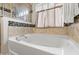 Bathroom featuring a garden tub with window at 358 Canna Dr, Davenport, FL 33897