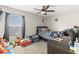 Bedroom featuring window, ceiling fan, and bedroom furniture at 358 Canna Dr, Davenport, FL 33897