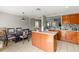 Bright kitchen with a kitchen island, view of dining room and living room, and stainless appliances at 358 Canna Dr, Davenport, FL 33897