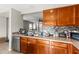Kitchen counter and cabinets with view of the dining room, sink, dishwasher and other appliances at 358 Canna Dr, Davenport, FL 33897