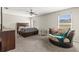 Main bedroom featuring a ceiling fan and natural light from windows and furniture at 358 Canna Dr, Davenport, FL 33897