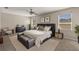 Spacious main bedroom retreat with a king-size bed, ample natural light, and modern decor at 358 Canna Dr, Davenport, FL 33897