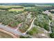 An aerial view shows the property's boundaries, the home's placement, and mature landscaping with nearby lake at 3979 Mammoth Grove Rd, Lake Wales, FL 33898