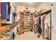 Walk-in closet with extensive shelving and organized storage for clothing and shoes at 3979 Mammoth Grove Rd, Lake Wales, FL 33898