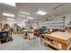 Spacious garage featuring overhead lighting, lots of space for working on projects and parking at 3979 Mammoth Grove Rd, Lake Wales, FL 33898