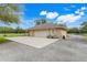 Detached garage with an extended driveway and ample parking space for multiple vehicles at 3979 Mammoth Grove Rd, Lake Wales, FL 33898