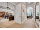 Hallway with arches and neutral colors leading to the living room and bedroom at 3979 Mammoth Grove Rd, Lake Wales, FL 33898