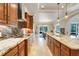 Gourmet kitchen with granite countertops, stainless steel appliances, custom cabinetry, and an island with seating at 3979 Mammoth Grove Rd, Lake Wales, FL 33898
