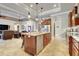 Open kitchen featuring a large island with granite countertops and stainless steel appliances at 3979 Mammoth Grove Rd, Lake Wales, FL 33898
